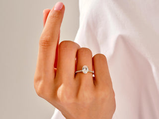 1.50 carat lab-created oval moissanite ring with shimmering pavé side stones