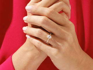 Classic cathedral setting engagement ring featuring 1.50 carat oval moissanite