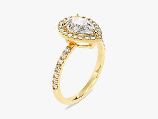 Pear-shaped moissanite engagement ring with halo of pavé-set diamonds and elegant band