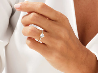 Heart-shaped moissanite diamond ring with sparkling pavé band, perfect for proposals