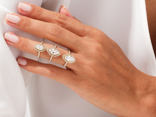 Radiant-cut moissanite engagement ring with twisted pavé diamond band, perfect for proposals