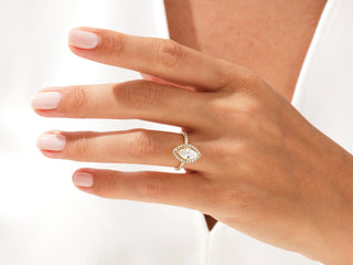 Twisted pavé engagement ring with radiant-cut moissanite center stone for proposal