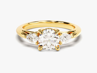 Round Moissanite Diamond Three-Stone Engagement Ring with pear-shaped side stones for timeless elegance.