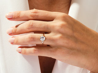 Timeless emerald-cut moissanite cluster engagement ring with sparkling diamonds