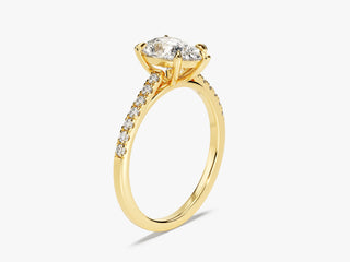 Timeless pear-shaped moissanite engagement ring with pavé diamonds on band