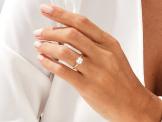 Elegant cushion moissanite ring featuring twisted band and sparkling pave diamonds