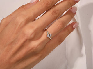 Ethical 1.0 CT oval moissanite ring with brilliant diamond cluster setting.